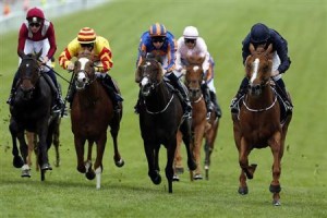 Ruler of the World ridden by Ryan Moore (R) races for the finish line to win The Derby during the Epsom Derby festival in Epsom, southern England June 1, 2013. REUTERS/Stefan Wermuth